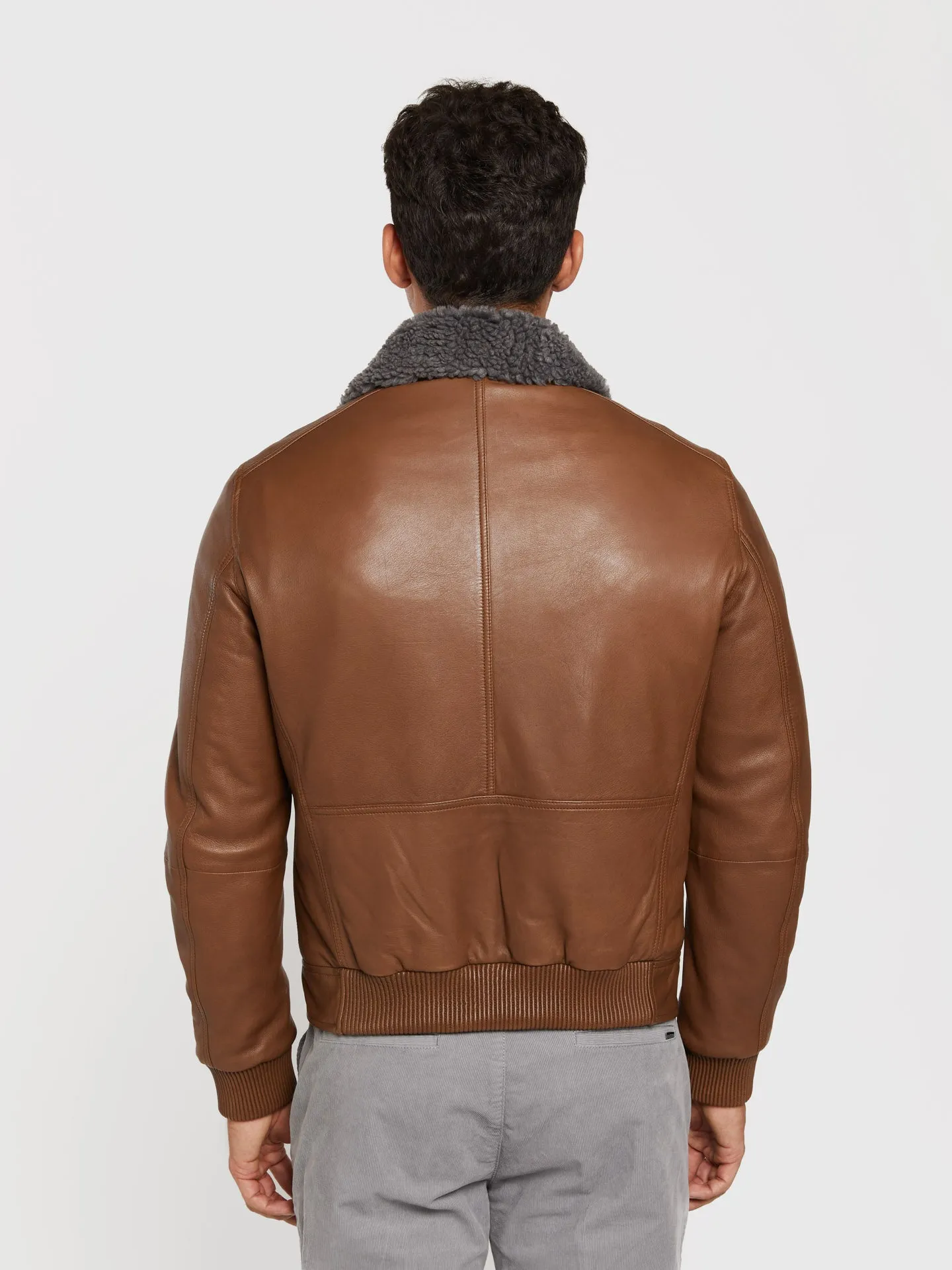 Leather aviator jacket with detachable recycled fur