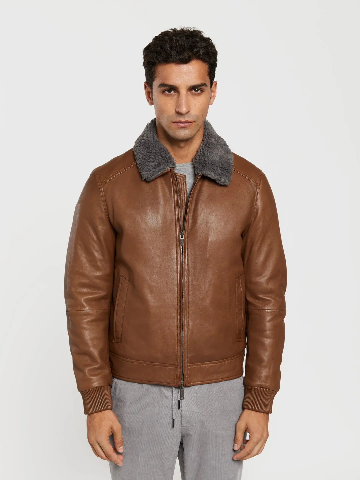 Leather aviator jacket with detachable recycled fur